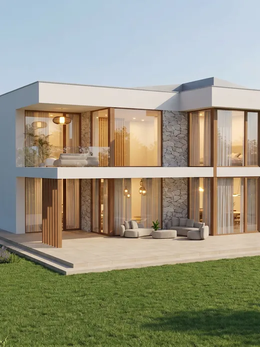 Rear facade of Marea villa at dusk with an open terrace lounge, folding glass doors, and interior lighting glowing through stone-clad columns.