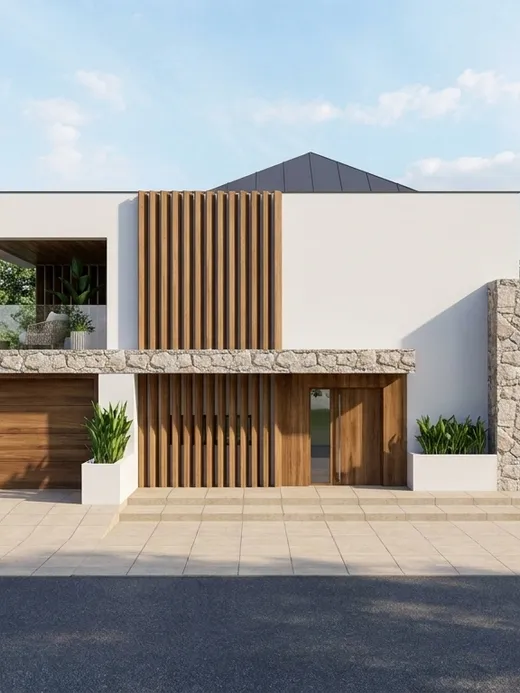 Front facade of Duna villa with white render, a vertical timber slat entry screen, split-face stone cladding, and a covered upper terrace.