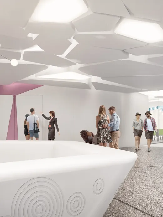 Reception hall with a sculptural white counter and an organic honeycomb ceiling.